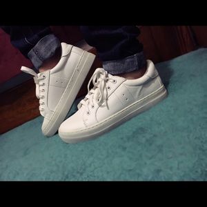 Report white sneakers